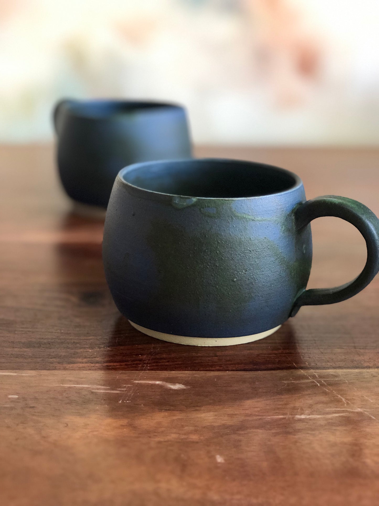 Matte green and blue round mugs