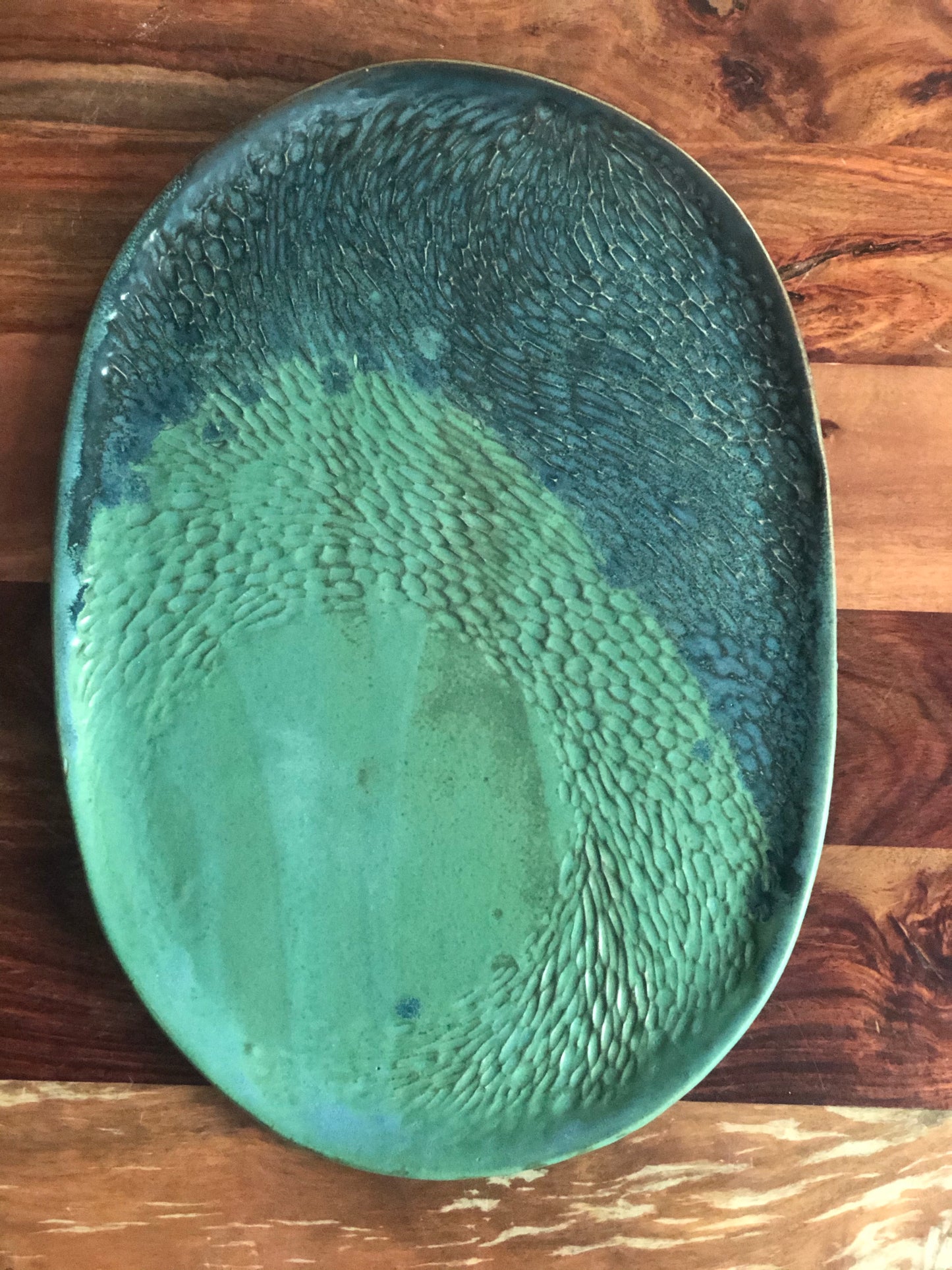 Carved green and blue oval platter