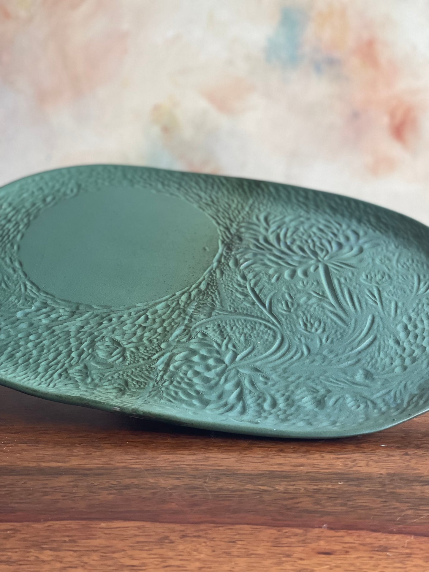 Large carved green oval platter