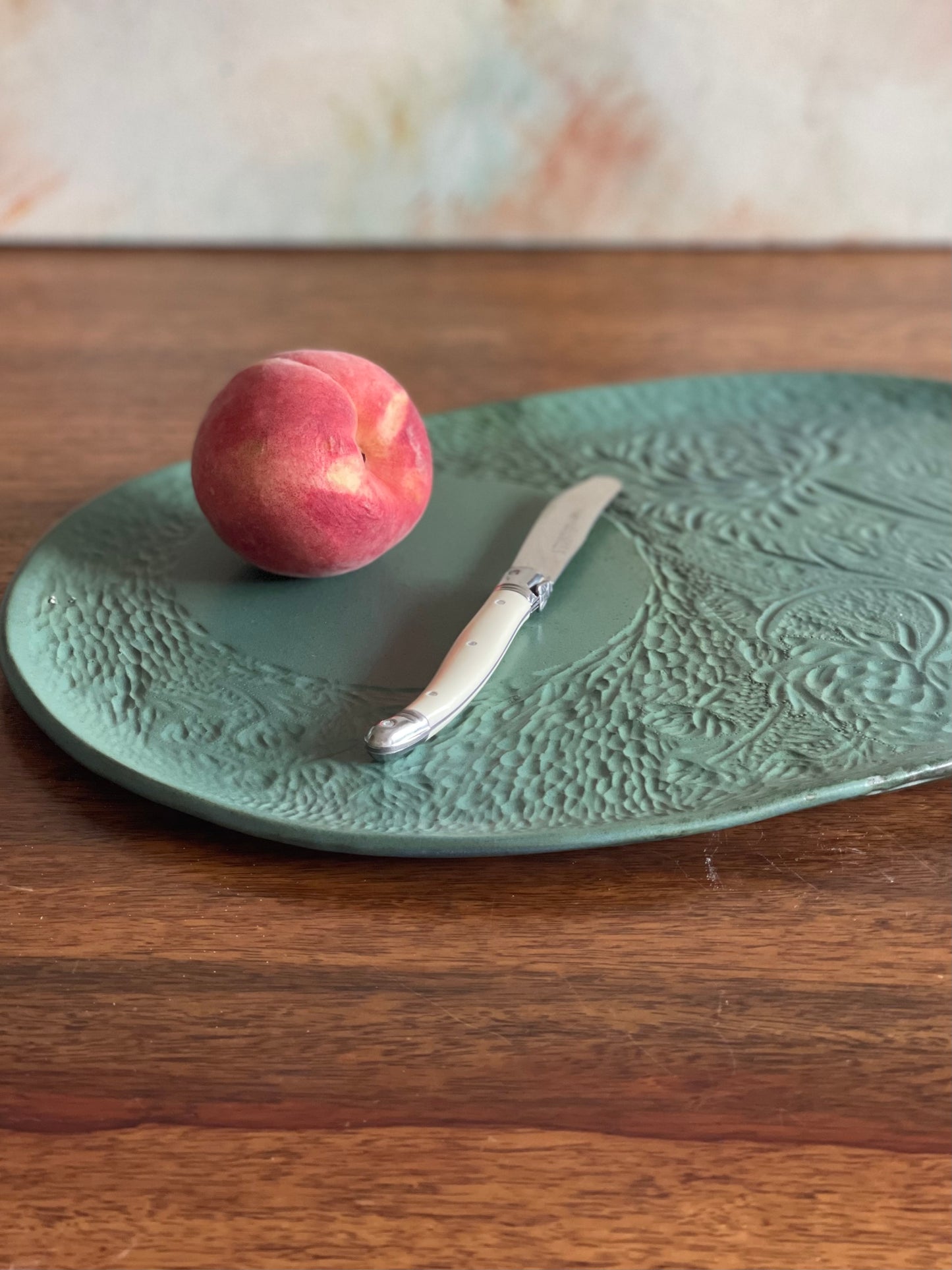 Large carved green oval platter