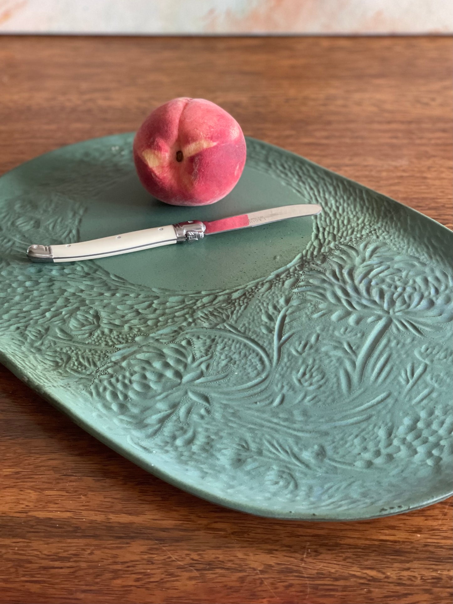Large carved green oval platter