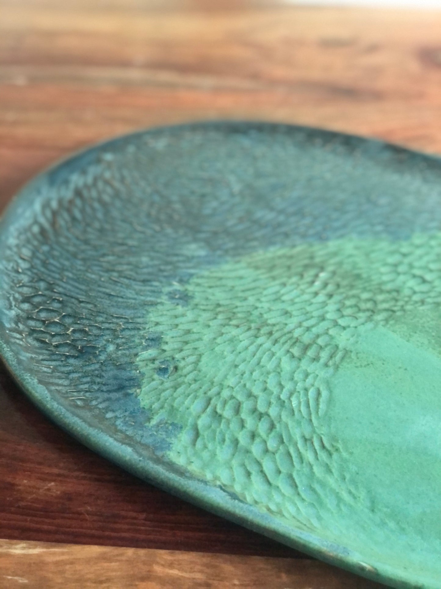 Carved green and blue oval platter