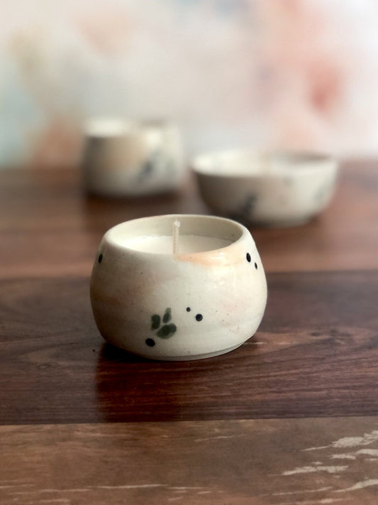 Tiny painted cup or bowl (candle optional)