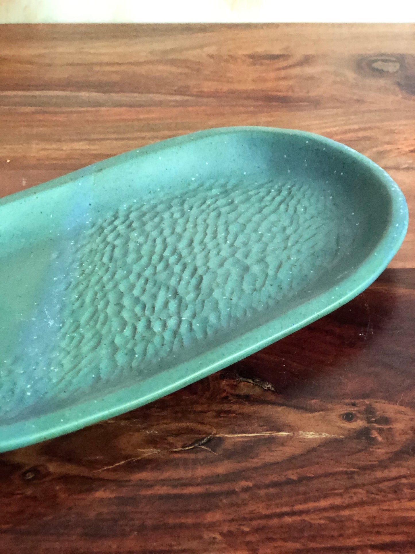 Carved green oval plate