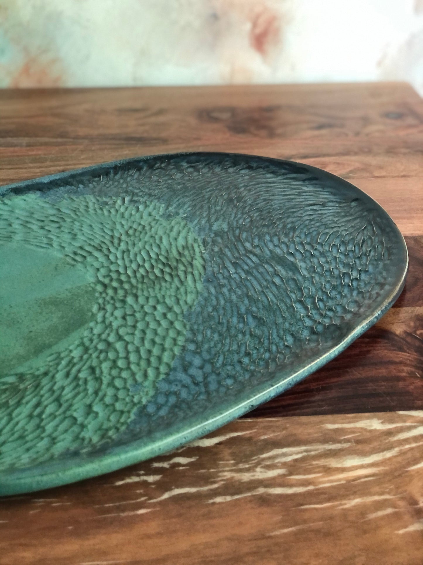Carved green and blue oval platter